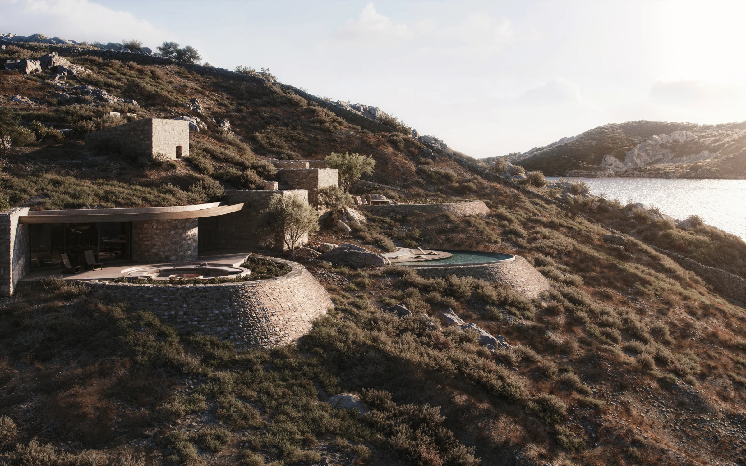 Maison Cheval curved stone terraces above a coastal cove